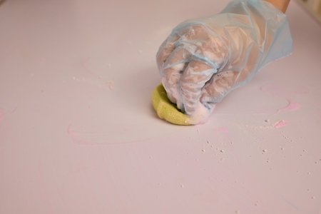 Engaging in Creative Hand son Crafting with Colorful Dough on a Charming Pink Surfaceの写真素材