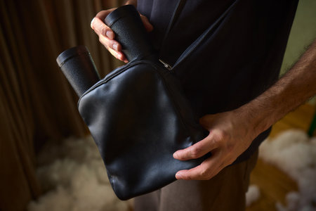 This stylish black bag features unique handles, making it perfect for trendy outfits and occasions