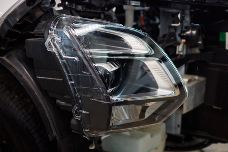 Careful precision is essential when installing a car headlight assembly for optimal performanceの写真素材