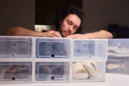 Organizing clear shoe containers effectively, Arranging transparent footwear storage with focus and...