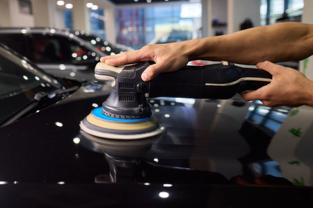 Polishing black car surface thoroughly, Detailed buffing to achieve showroom quality shine, Expert...