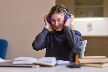 Young lady with cerebral palsy studying using technological aids, Enthusiastic woman with cerebral...