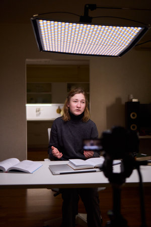 Young lady with cerebral palsy studying using technological aids, Enthusiastic woman with cerebral...