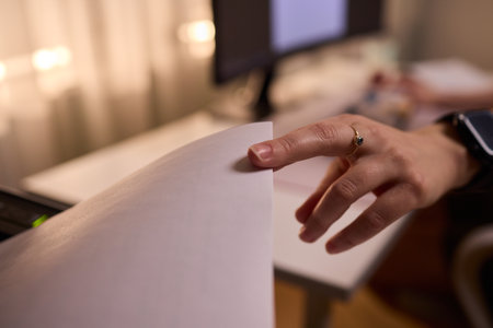 Work environment with paper loading, Assistant inserting paper into laser printer desk, Quiet office...