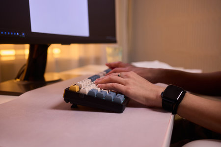 Typing on keypad with smartwatch, User engaging with numeric keypad and smartwatch, Focused...