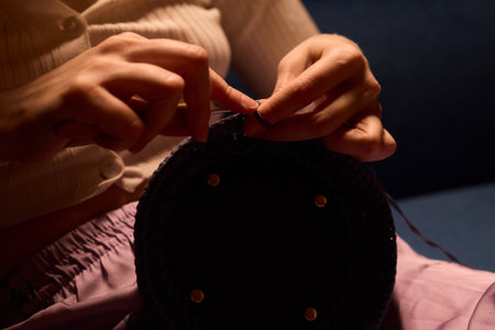 Crochet workshop scene, Artisan at work with yarn, Cozy crafting space with textured handmade stitches, Quiet studio environment dedicated to knitting and crochet crafts todayの写真素材