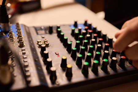 Closeup of tactile controls and vibrant patch cords in studio, Adjusting analog sequencing equipment...