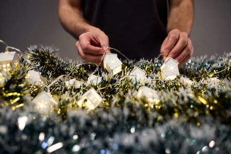 Decorative festive scene, Intimate shot of illuminated cottages with festive accents, Careful...