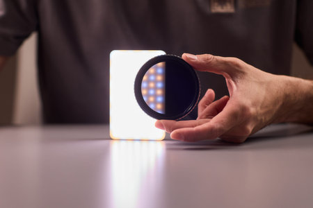 Polarizer smartphone display. Mobile device with polarizing filter and grid pattern focus. Detailed...
