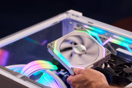 Colorful fan held over motherboard vibrant addressable lighting, braided cables, aesthetic build,...
