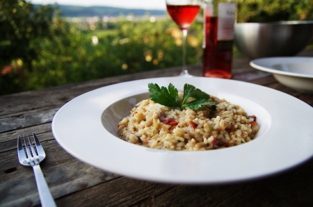 Risotto on rustical table outdoorsの写真素材