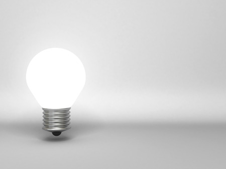 single light bulb on gray background with copy space for textの写真素材