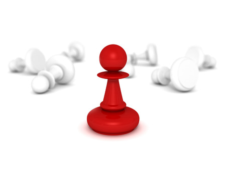 red pawn standing in front of some white lying pawnsの写真素材
