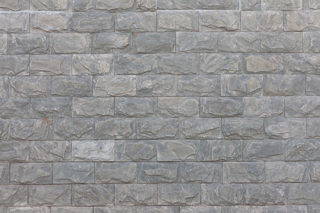 Fence made of artificial stone. Textural backgroundの写真素材