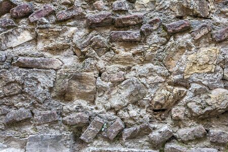 Old cracked stone masonry wall texture. Grunge design backgroundの写真素材