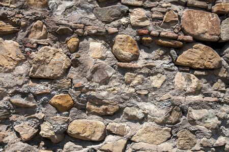 Old cracked stone masonry wall texture. Grunge design backgroundの写真素材