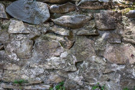Old cracked stone masonry wall texture. Grunge design backgroundの写真素材