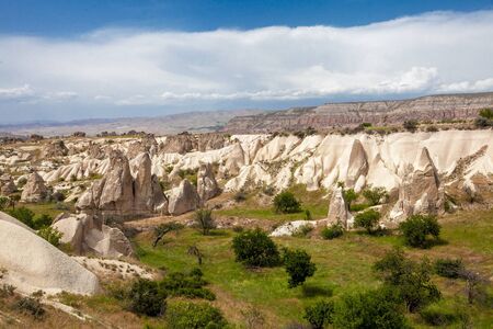 Beautiful mountains rocks landscape. Cloudy sky. Cappadocia, Nevsehir Province, Anatolia Region of Turkeyの写真素材