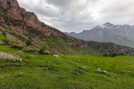 Mountains rocks landscape with cloudy dramatic sky. North nature background.の写真素材