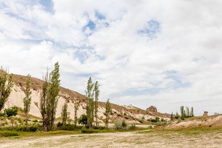 Beautiful mountains rocks landscape. Cloudy sky. Cappadocia, Nevsehir Province, Anatolia Region of Turkeyの写真素材