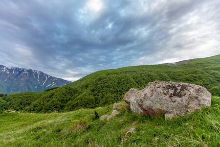 Mountains rocks landscape with cloudy dramatic sky. North nature background.の写真素材