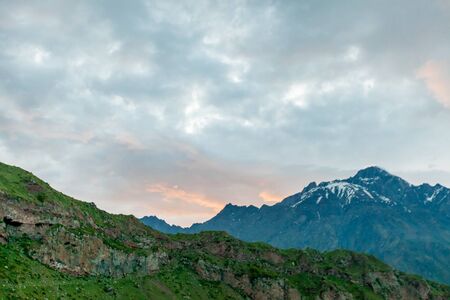 Mountains rocks landscape with cloudy dramatic sky. North nature background.の写真素材