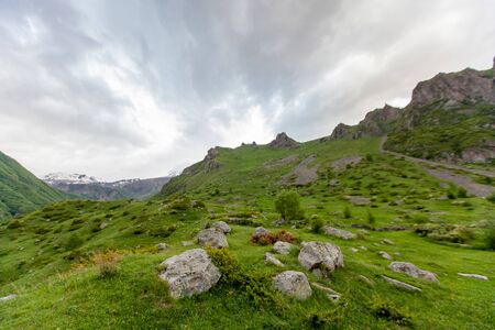 Mountains rocks landscape with cloudy dramatic sky. North nature background.の写真素材