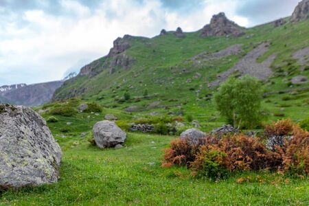Mountains rocks landscape with cloudy dramatic sky. North nature background.の写真素材