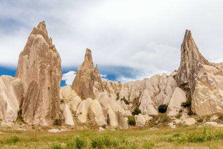 Beautiful mountains rocks landscape. Cloudy sky. Cappadocia, Nevsehir Province, Anatolia Region of Turkeyの写真素材