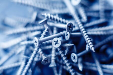 Steel tapping screws abstract background. Industrial pattern conceptの写真素材