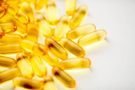 Fish oil capsules pills heap. Medicine backgroundの写真素材