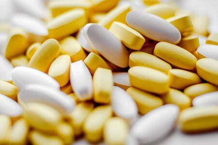 Different pharmacology capsules pills heap. Medicine background