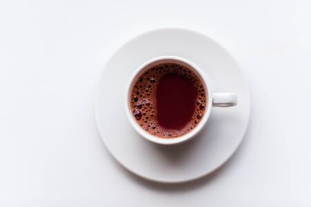 White hot coffee cup on windowsill. Morning breakfast concept backgroundの写真素材