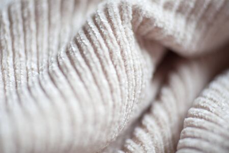 Wool fabric texture close up background. Cozy style cloth. Wavy folds materialの写真素材