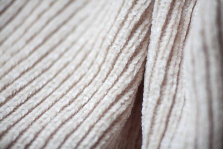 Wool fabric texture close up background. Cozy style cloth. Wavy folds materialの写真素材
