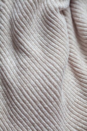 Wool fabric texture close up background. Cozy style cloth. Wavy folds materialの写真素材