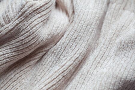 Wool fabric texture close up background. Cozy style cloth. Wavy folds materialの写真素材