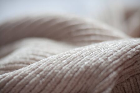 Wool fabric texture close up background. Cozy style cloth. Wavy folds materialの写真素材