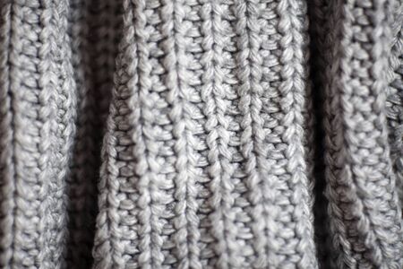 Wool fabric texture close up background. Cozy style cloth. Wavy folds materialの写真素材