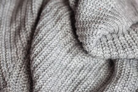 Wool fabric texture close up background. Cozy style cloth. Wavy folds material