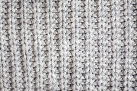 Wool fabric texture close up background. Cozy style cloth. Wavy folds material