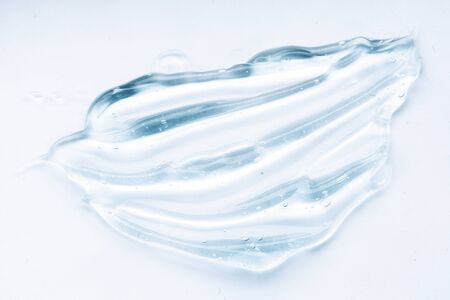 Transparent liquid gel cream smudge on white background. Blue cosmeticsの写真素材