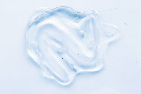 Transparent liquid gel cream smudge on white background. Blue cosmeticsの写真素材