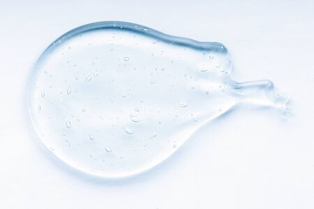 Cosmetic cream transparent liquid gel.  Blue smudge on white background
