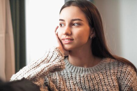 Young woman pretty relaxing on couch in living room. Casual style indoor shootの写真素材