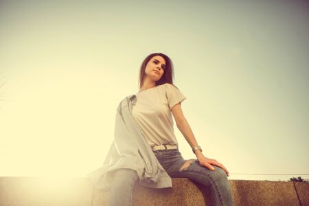 Beautiful tourist girl on city street. Gorgeous young model woman outdoor portrait. Fashionable wear.の写真素材