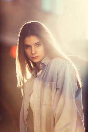 Hipster girl casual wear. Summer city portrait. Young tourist woman walks in town