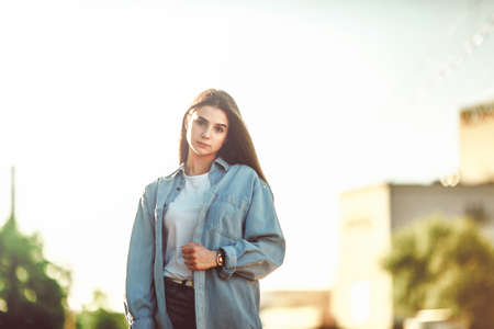 Beautiful tourist girl on city street. Gorgeous young model woman outdoor portrait. Fashionable wear.の写真素材