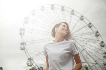 City portrait of a fashionable beautiful young girl. Outdoor relaxing trendy woman modelの写真素材