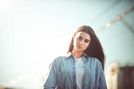 Beautiful tourist girl on city street. Gorgeous young model woman outdoor portrait. Fashionable wear.の写真素材